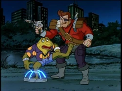 Genghis caught in Dirk Savage's mutant trap.