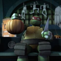 Raph Carving a Pumpkin