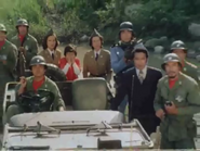 Red Muffler members watch 17 ramming himself into Brain