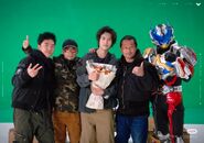 Action director Kouichi Sakamoto with the cast and crew.