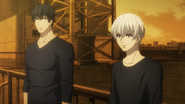 Amon and Kaneki reunite on a rooftop.