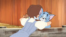 Dorothy hugging Tom and Jerry.