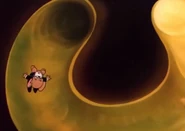 Jerry sliding inside the "U" shaped part of the tuba