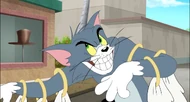 Tom's evil grin