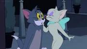 Toodles kissing Tom on the cheek.