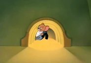 Jerry peeking out of the mousehole