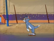 Tom wearing rollerskates