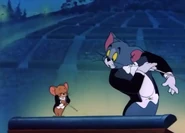 Tom surprised to see Jerry trying to conduct with him