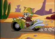 Screenshot 2024-06-11 at 07.10.37.png (1.57 MB) Tom Junior riding a motorcycle.