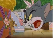 Tom confronts Jerry, moments before the mouse attaches a "Do Not Open 'Til Xmas" sticker to Tom's mouth