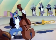 Tom taking over the cello after the cellist disappears