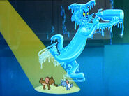 Jerry and Tuffy are dancing around a frozen Tom.