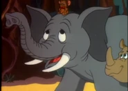 Elephant and animals giving Tarzan Jerry a ride