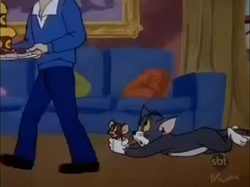 Spike's Birthday - Tom and Jerry looking at the cake.PNG