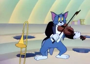 Tom playing a violin