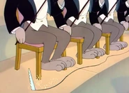 Jerry sawing below more violinists