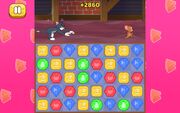 A cartoon cat and mouse chasing under a series of colorful blocks