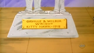 Kitty Hawk Kitty - Orville and Wilbur Wright statue