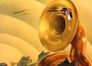 Jerry sliding inside the tuba