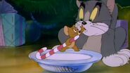 Jerry prevents Tom drink milk