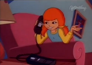 Eliza calls Marcie on the telephone and starts talking with her