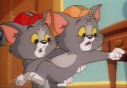 Tim tells Tom that Jerry is in the kitchen
