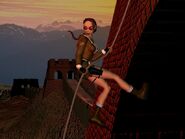 Image promotionnelle de Lara Croft escalant la Grande Muraille de Chine dans Tomb Raider II.