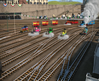 Trzy lokomotywy manewrowe widoczne w tle