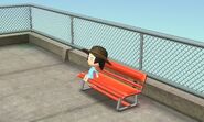 A Mii sitting on a bench.