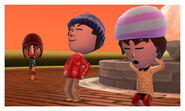 Two Miis work out at the fountain while a third watches.