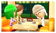 Three girl Miis talking at the cafe.