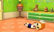 A Mii rolling around on the floor.