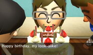 A Mii giving the player a Birthday Cake for their birthday.