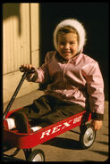 In her red wagon