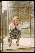 Slide 5 - Tanya on a swing