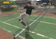 Tony Hawk sliding the tennis net in College