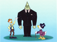 Gyro presenting a Cog to Scrooge