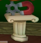 A Small Magnet on display in Toon Hall attached to a Cog gear