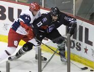 MacDonald fighting for the puck