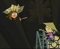 The Chinese woman throws a hammer at Courtney's face.