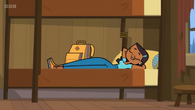 Priya relaxing in her bed.