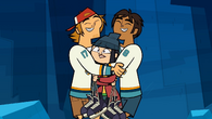 Wayne and Raj hug MK.