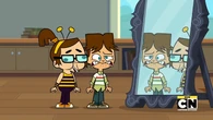 The kids make one more goofy face into the mirror.
