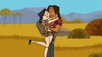 Heather and Alejandro hugging in victory.
