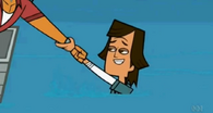 Alejandro helps Noah into their team's boat.
