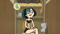 Gwen using the confessional in her swimsuit.