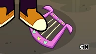 Beth steps on her angel wings harp.