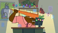 Chef repeatedly hits himself with a giant carrot.