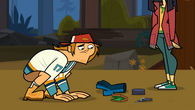 Wayne coughs out objects.
