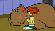 Scarlett beautifies a bear.